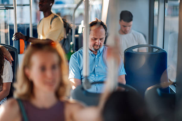 istock Passengers sitting and standing on a moving bus 2228233753