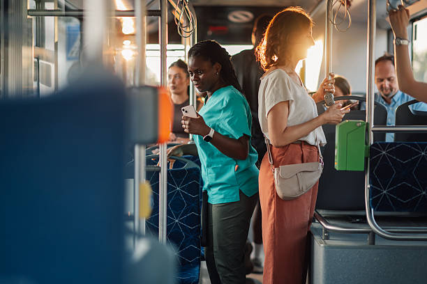 istock Passengers using smartphones on a public transport bus during commute 2228233854