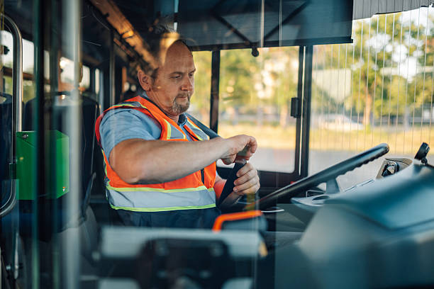 istock Bus driver fastening seat belt before starting route 2228233881