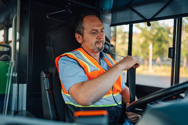 istock Bus driver fastening seat belt before starting route 2228233885