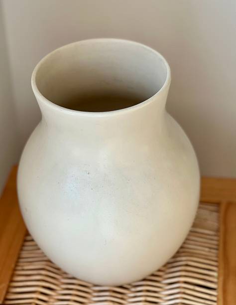 istock White vase on wooden rattan 2228234091