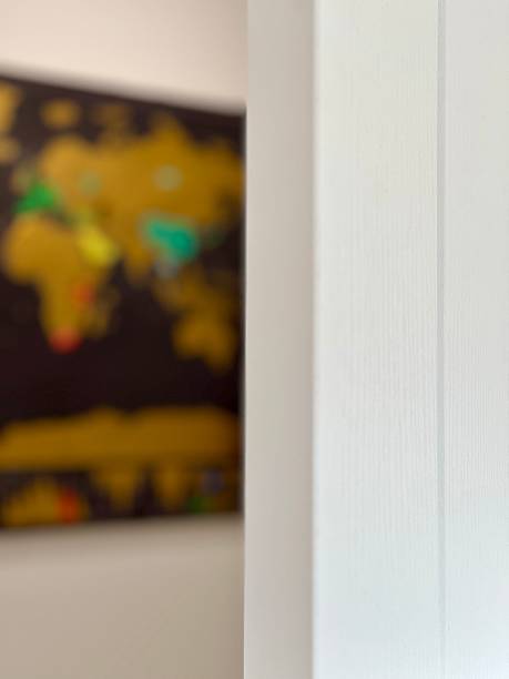 istock Wooden door open and world map 2228234605