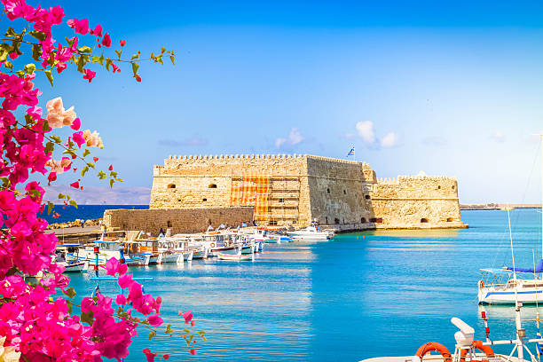 Heraklion harbour with old venetian fort, Crete, Greece with flowers