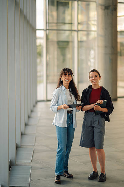 istock Two young businesswomen collaborating using digital tablet in modern office 2228240549
