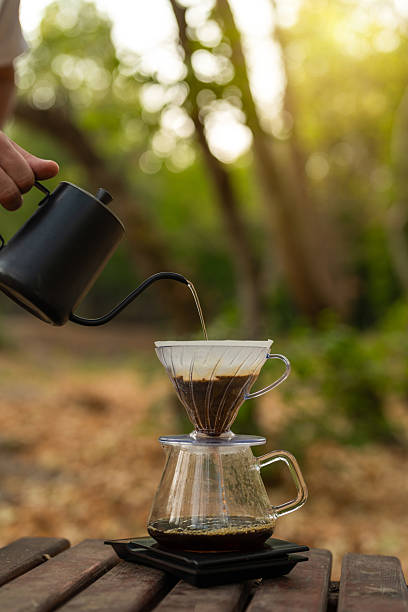istock Brewing coffee on a bench in nature. 2228244270