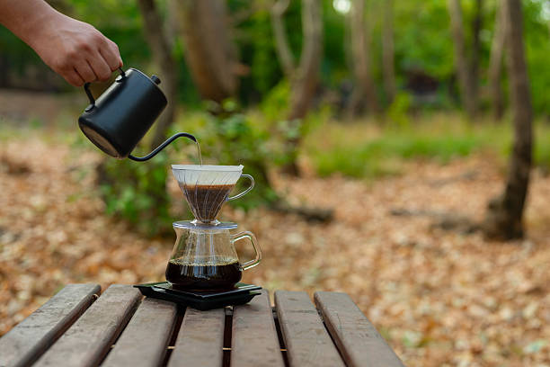 istock Brewing coffee on a bench in nature. 2228244271