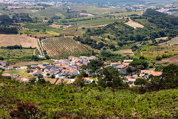 istock Rolling Hills and Rural Village in Summer Light 2228247534