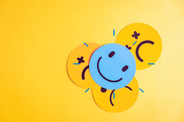 istock Emotional state and mental wellness. Smiley face by multiple sad expressions showing mood variation and contrast. Useful for psychology, emotion tracking, and mental health themes. 2228249593