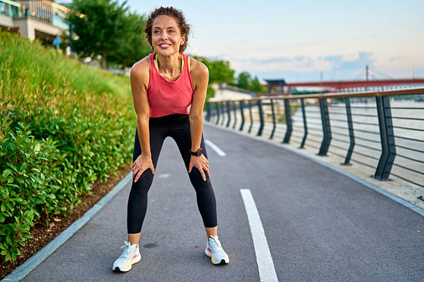 istock Woman taking a break during her outdoor workout routine 2228249959