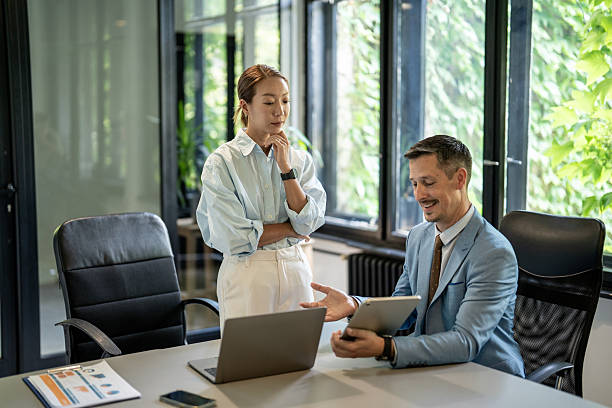 istock Business professionals collaborating in modern office 2228250677