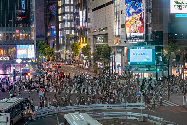 Tokyo, Japan - July 22, 2025:Shibuya Scramble Crossing is a popular pedestrian scramble crossing in Shibuya, Tokyo, Japan. It is located in front of the Shibuya Station Hachikō exit and stops vehicles in all directions to allow pedestrians to inundate the entire intersection.