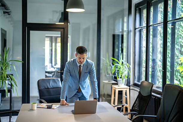istock Businessman is working on laptop computer in modern office 2228253756