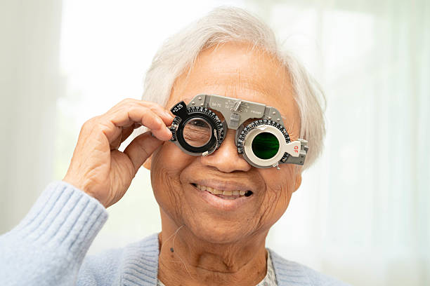 istock Optometrist checking Asian elderly woman ophthalmic vision eye test and using optical trial frame. 2228256856