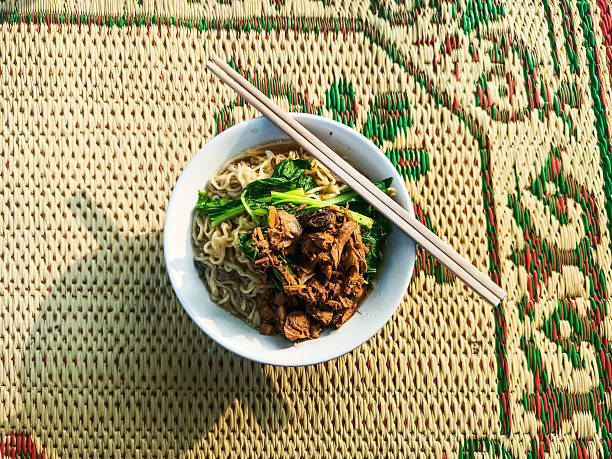 delicious chicken noodles on a mat