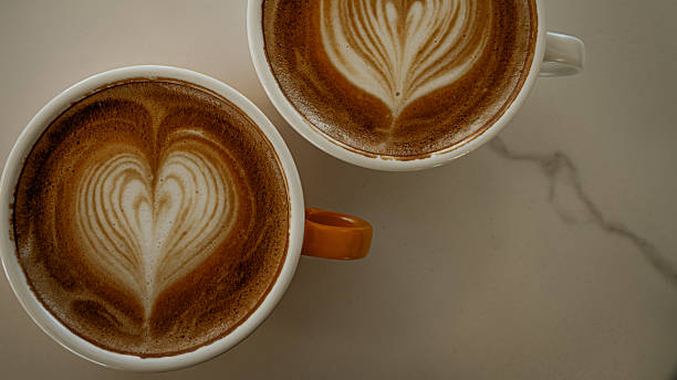 istock Cups of coffee decorated with a heart 2228259686