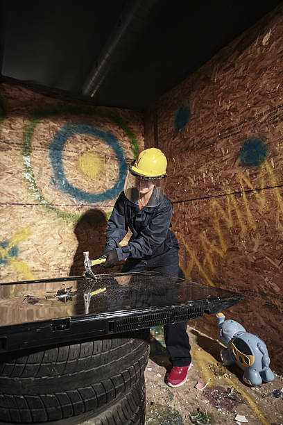 istock Mature woman  breaking stuff inside rage room 2228261657