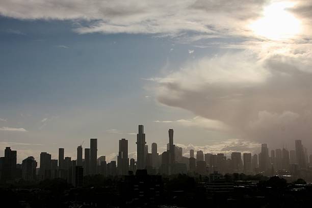 Melbourne with a dramatic sky and looks multilayers in silhouette