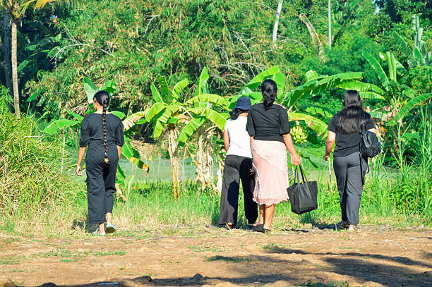 istock Four girls walking side by side under bright sunlight 2228263334