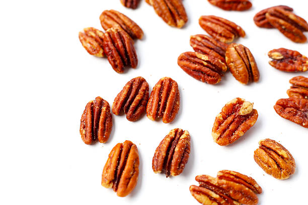 istock Delicious salted pecan nuts scattered. 2228264571