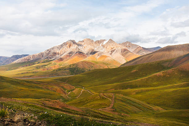 istock Panoramic view of a vast mountain valley under a cloudy sky 2228268069