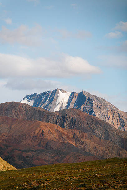 istock Snowcapped mountain range against a blue sky 2228268219