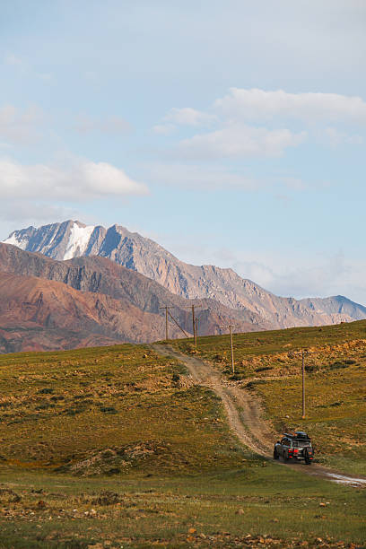 istock Off-road vehicle on a dirt road in a mountain landscape 2228268270