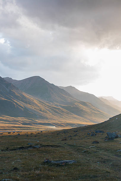 istock Sunrise in a vast mountain valley with rolling hills 2228269661