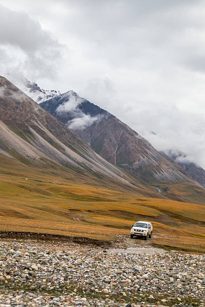 istock Off-road vehicle in a rugged mountain valley 2228270338