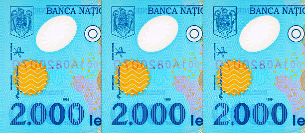 istock 2000 Lei Romania, 1999 with a simplified Solar System and a solar eclipse. Polymer money of Romania and Europe. 2228271399