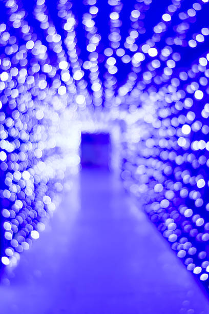 out of focus lights shaped like tunnels at vertical composition
