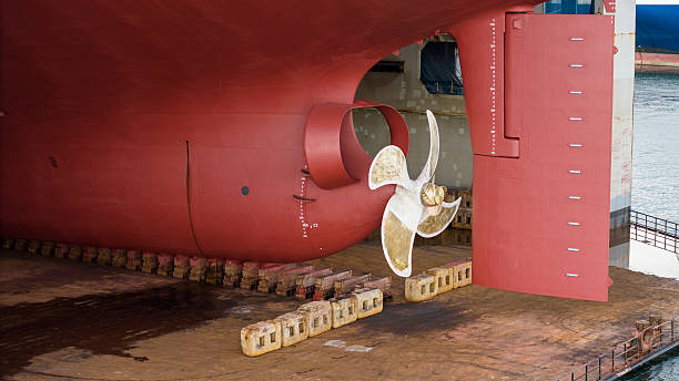 istock Propeller of large ship spinning power working and water splash contrail . Close up image detail Stern back of Vessel ship, Logistics Transportation industry express technology Freight. 2228272783