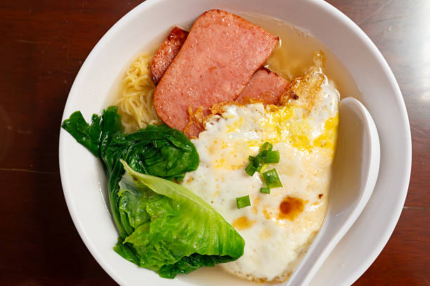 top view noodles with luncheon meat and fried egg at horizontal composition