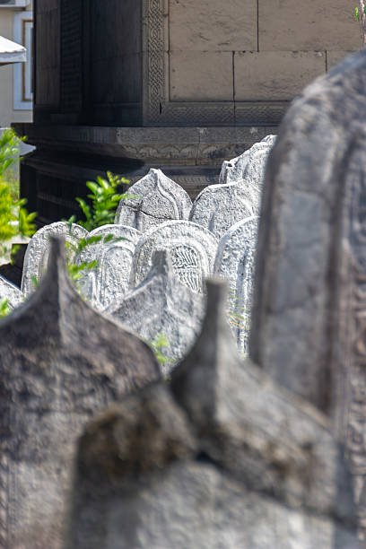 istock Ancient stone graves stand tall in a historic cemetery 2228274329
