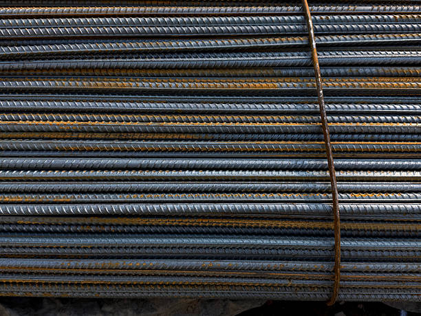 istock Corrugated steel rods texture. Construction materials concept. Handheld mobile photo, selective focus, sunlight, non AI 2228274531