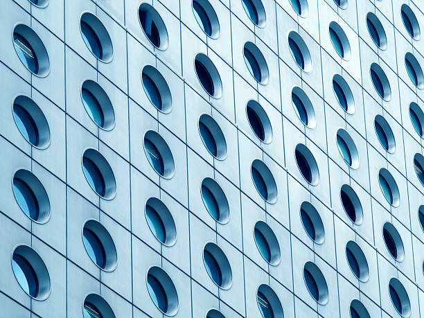 istock A tall and modern building featuring numerous windows adorning it 2228274606