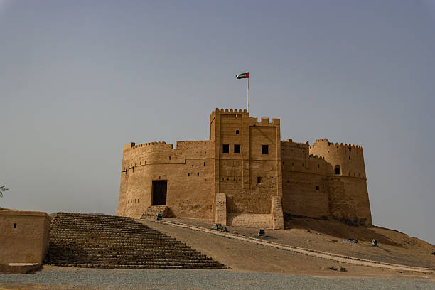 istock Grand Desert Fort on Hill with Waving Flag 2228276612