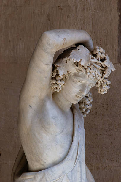 istock Graceful marble statue adorned with grape leaves and fruit. 2228277089