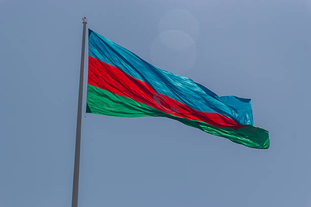 istock Azerbaijan National Flag Waves Proudly in Sky 2228277318