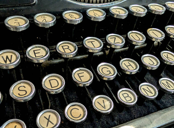 istock vintage typewriter with white keys and black letter symbols 2228277768
