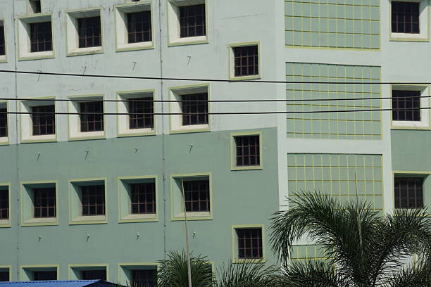 istock A multi-story building with numerous windows, likely an educational institution 2228279536