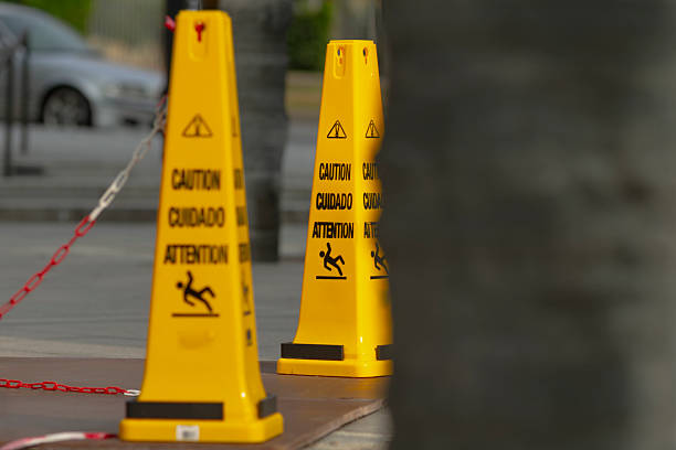 istock There is a noticeable row of yellow caution cones placed on a sidewalk 2228280855