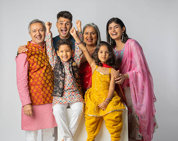 istock Three-generation family enjoying Diwali on white background 2228284705