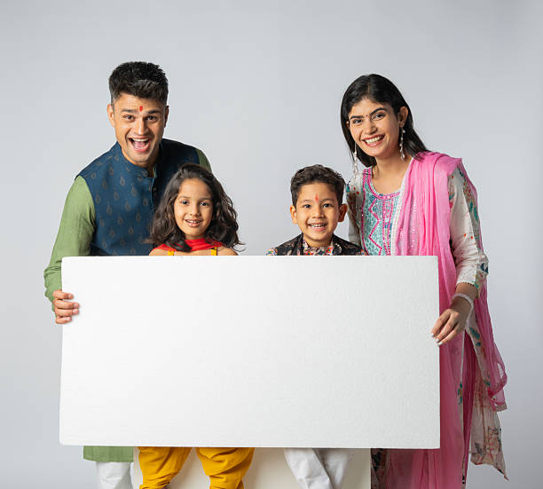istock Family with blank poster on white background during Diwali 2228284775