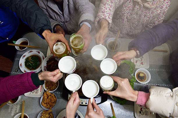 Top view of a dining table with a soup bowl and Korean Food Bibimbap.