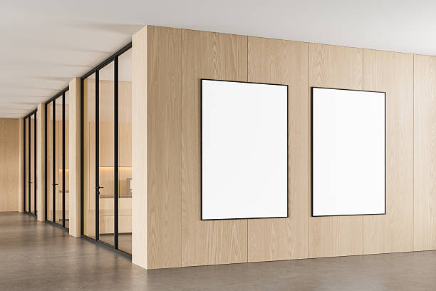 istock Two blank vertical posters on light wooden wall in modern bright office interior with glass partitions, ideal for clean design mockup or layout template. 3D Rendering 2228288969