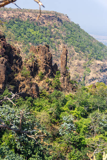istock Towering Rock Formation in Arid Indian Landscape 2228290535