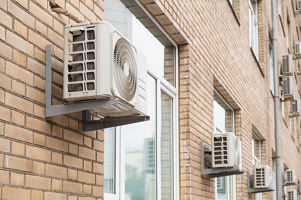 istock Outdoor air conditioning units on brick building wall 2228290570