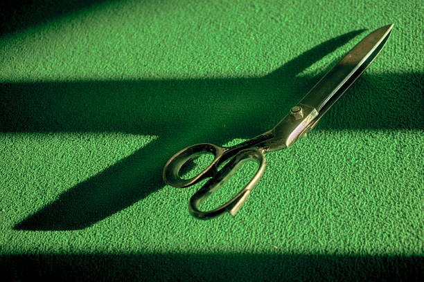 Bright school and office supplies including scissors, pens, pencils, sticky notes, paper clips, and markers scattered on a white surface.