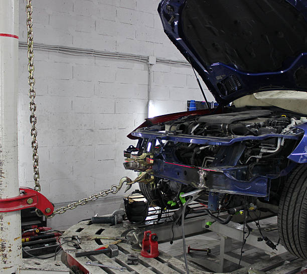 istock The Chains Pull Out the Damaged Frame of the Car on a Special Rack with a Servo Drive 2228291543