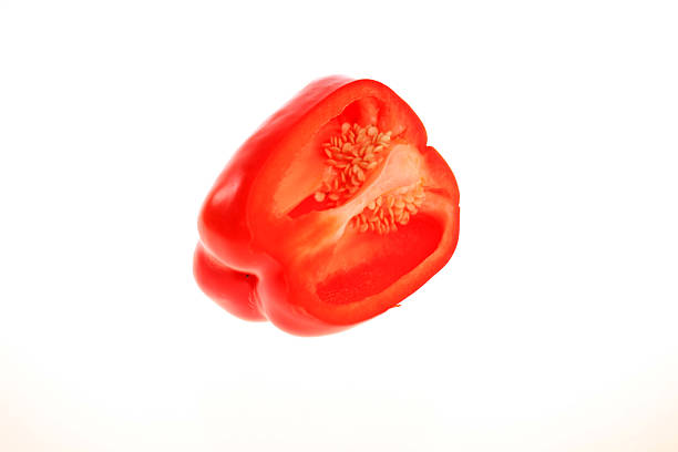 Studio shot of fresh sweet, baby peppers cut out against a white background
